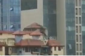Multi-storey building exterior with facade and rooftop architectural details